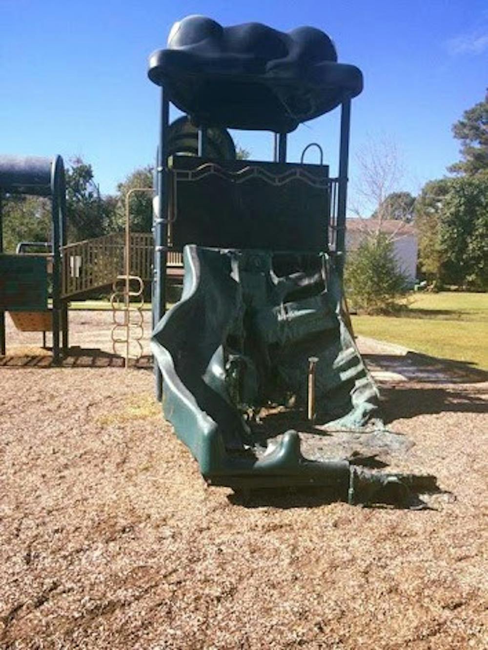 The Village Green playground was burned by a gang two years ago, neighbors said.