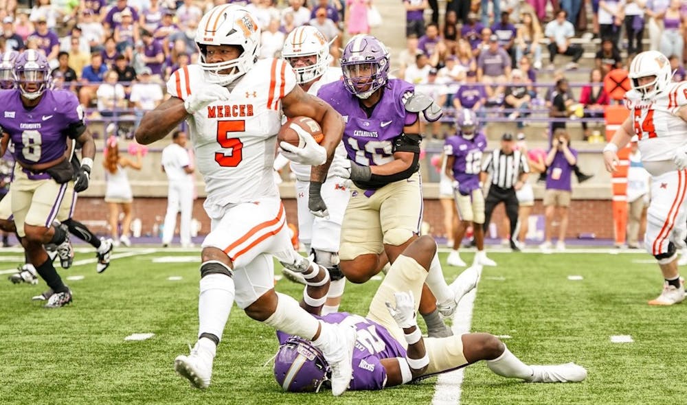 Al Wooten II '25 carries the ball against Western Carolina University. Wooten was the game's leading rusher with 68 yards and a touchdown as the Bears toppled WCU on Saturday, 45-38.
