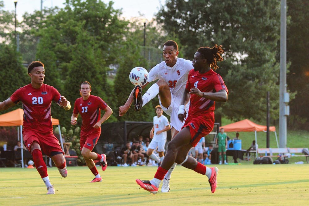 Christopher Nezianya '28 controls the ball among defenders in a game against Florida Atlantic University on August 20. 