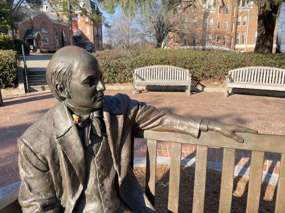 The Jesse Mercer statue near the historic quad gleams in the sun, with a small flower tucked into Jesse’s collar by a passing visitor.