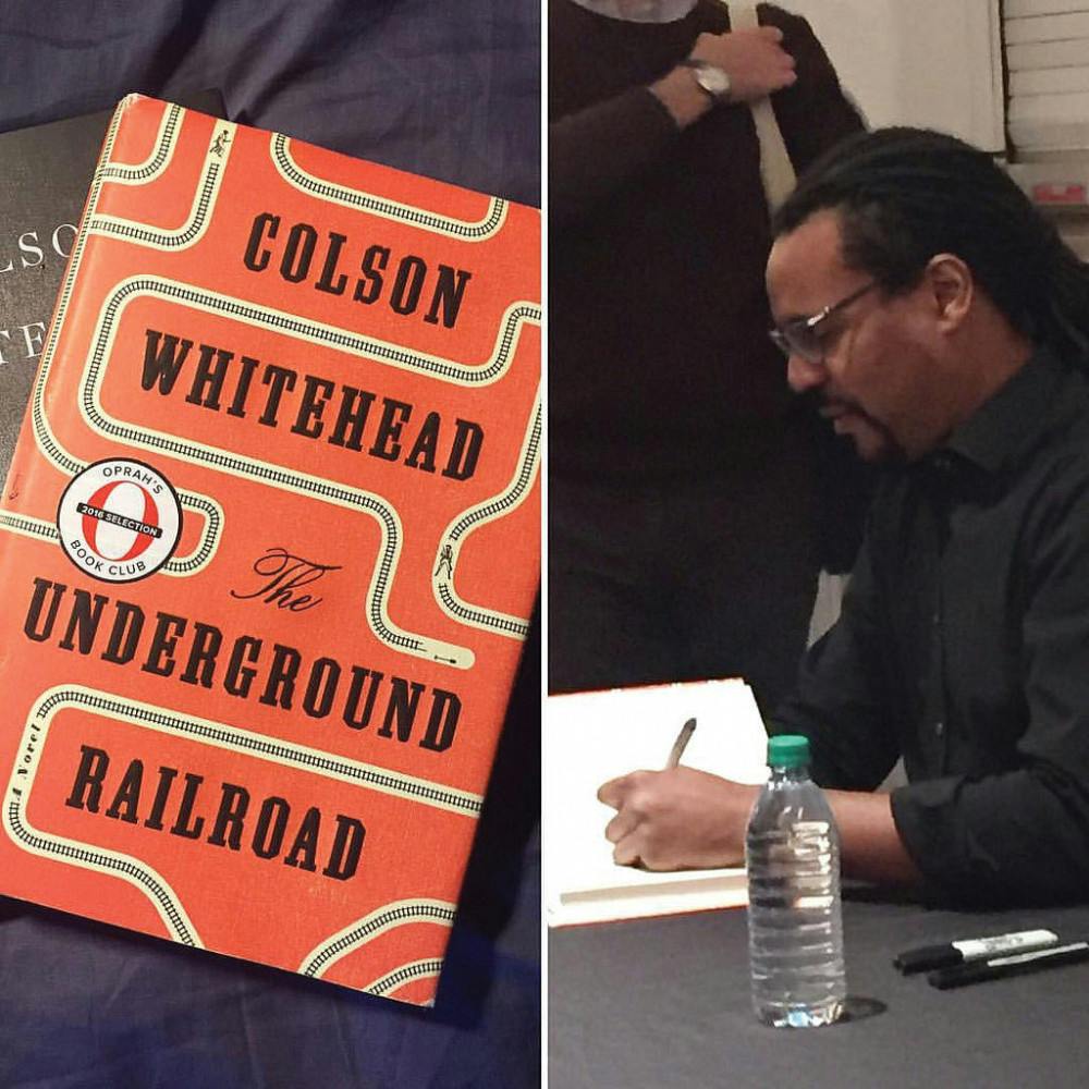 Colson Whitehead signs a copy of his book. 