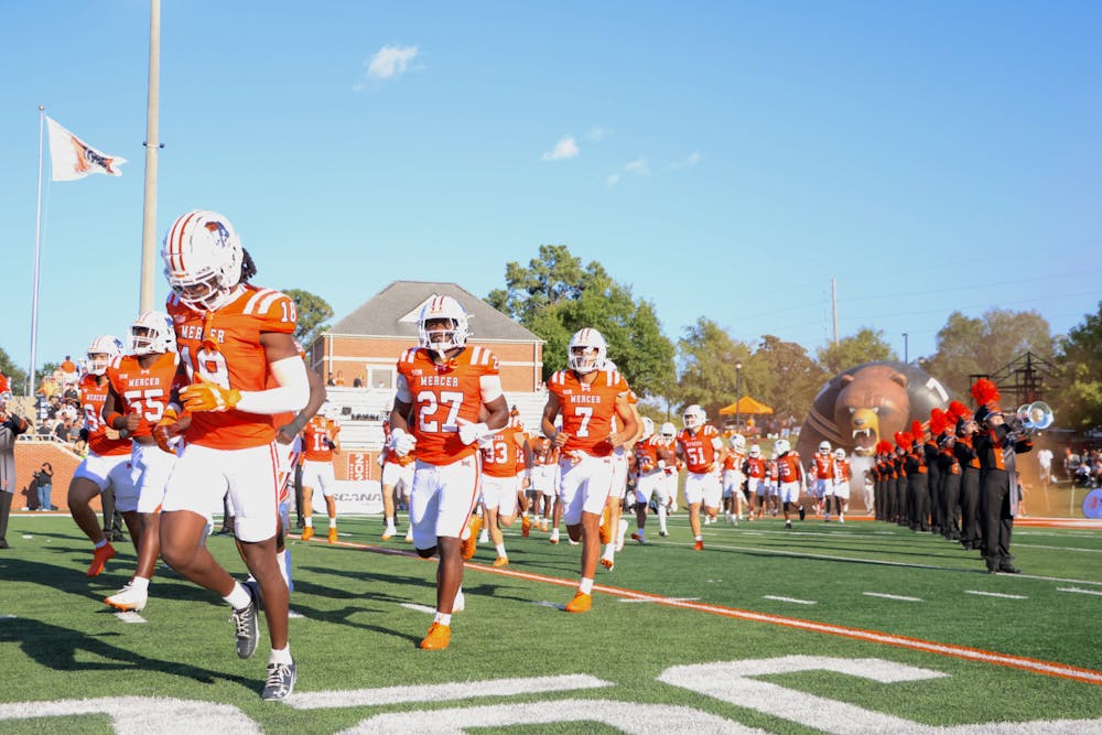 Mercer football runs onto the field before a game against Wofford College on Sept. 13, 2025.