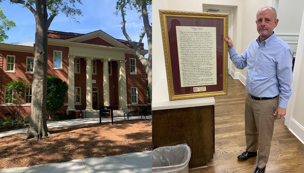 Wiggs Hall (left) fully renovated for students, faculty and staff to enter with Steve Brown (right) holding the Heritage Life History Trail Project’s history of the building.