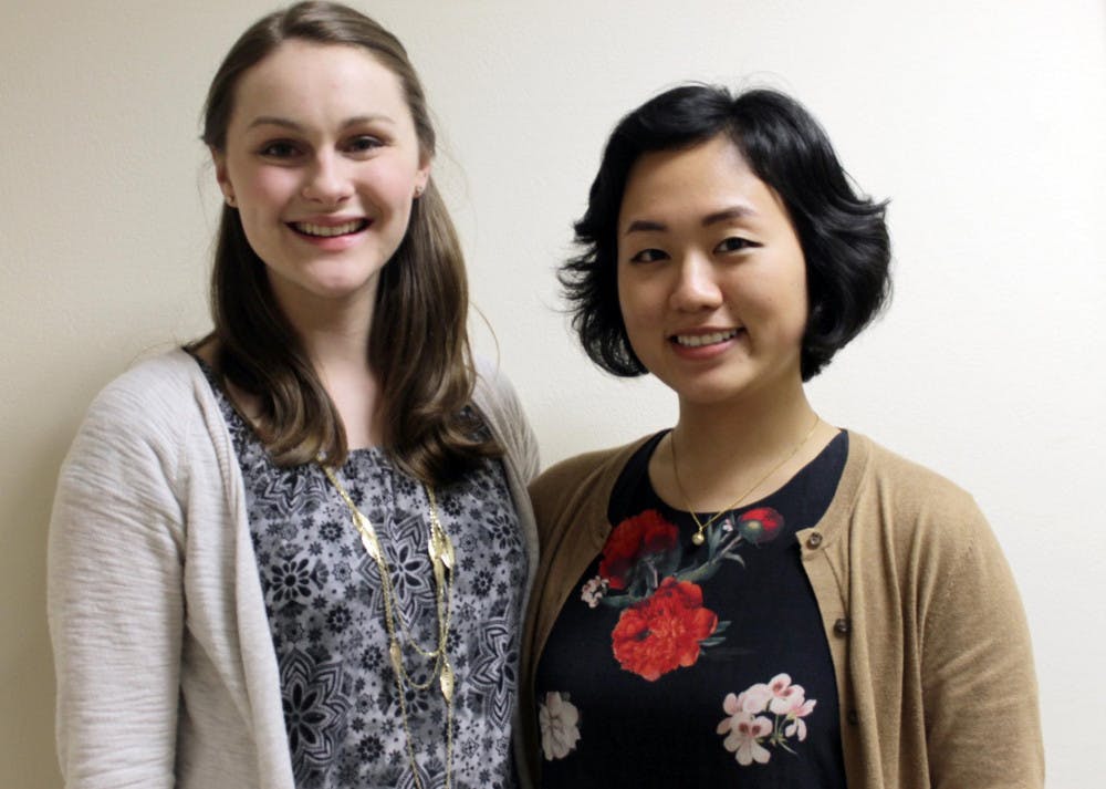 Newly inducted Phi Kappa Beta members Lauren Maxwell, senior, and Min Hyun Oh, senior, (left to right) were presented the nomination to join the society at Mercer's Medical School Feb. 29.