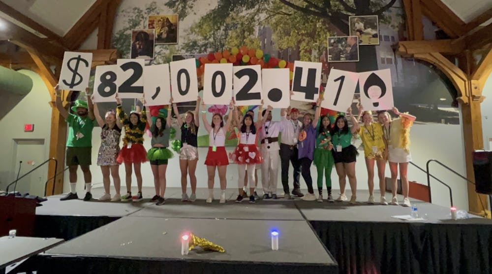 <p>Seniors in MU Miracle hold up the total amount raised during Bearthon to support Beverly Knight Children’s Hospital in Penfield Hall on Saturday, March 26. (Photo provided by MU Miracle)</p>
