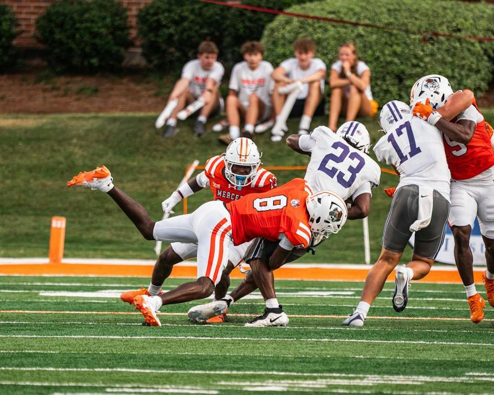 Cornerback Cameron Goggins '27 tackles a Furman University running back on Sep. 12, 2026