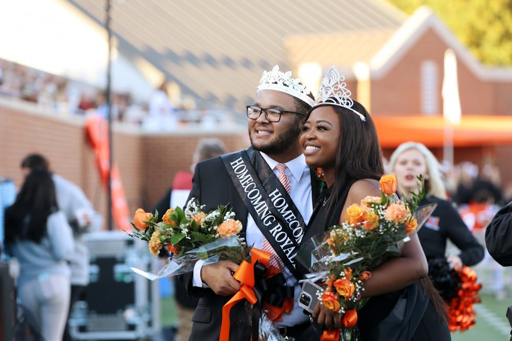 Rylan Allen (left) and Sheridan King (right) pose for a photo after winning Mercer University Homecoming King and Queen 2021, both representing Mercer's Student Government Association. Media provided by Mercer University. Photo by Leah Yetter.
