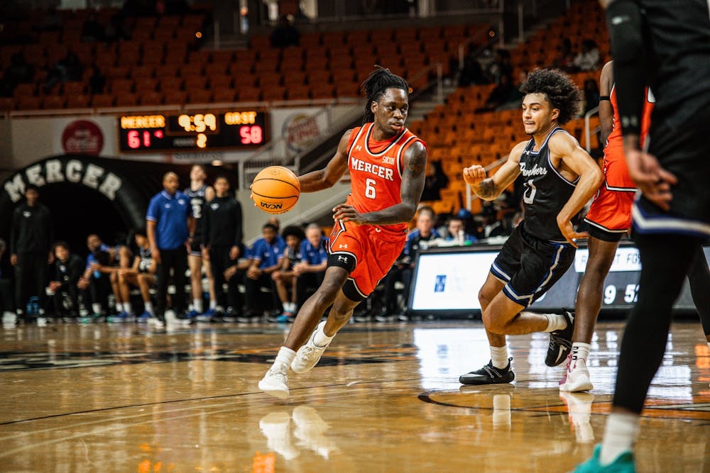 <p>Guard Baraka Okojie &#x27;27 drives to the paint in a game against Georgia State University on Dec. 2. </p>
