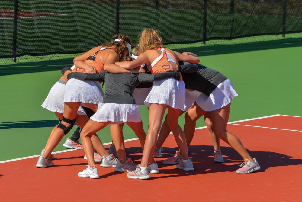 Mercer women's tennis team huddles up before match against Florida Gulf Coast University Feb. 22. Photo by Michael Rich