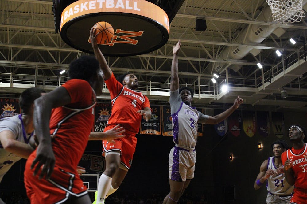 Ahmad Robinson '25 attempts a layup against Furman University on Jan. 25, 2025. Robinson shot 4-for-6 from deep against the Paladins on his way to scoring 24 points in the game.