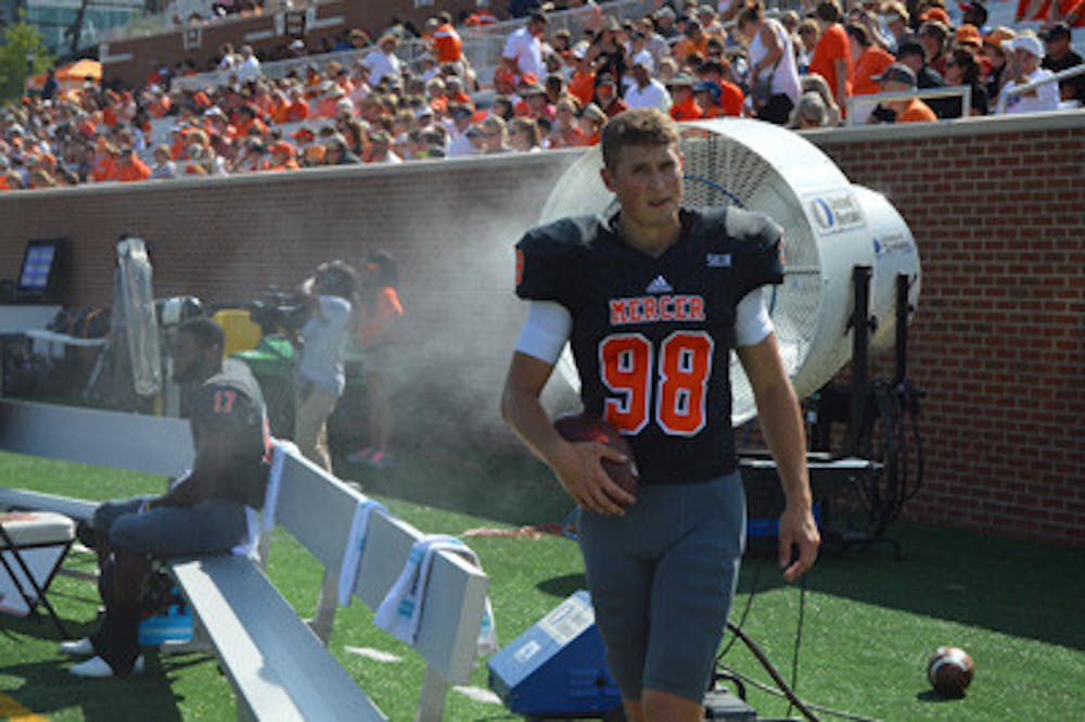 Cole Fisher cooling off on the sidelines of the Mercer versus Tennessee Tech home game.
