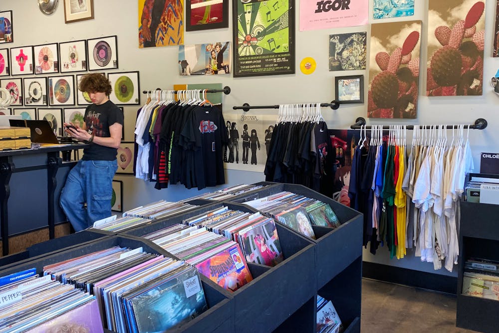 “I’m the one that pulls all the orders together and puts them on the packing table for the team to pack," Noah Silver '26, who was actively checking on online orders while preparing for the Florence + The Machine listening party on Oct. 31, said.