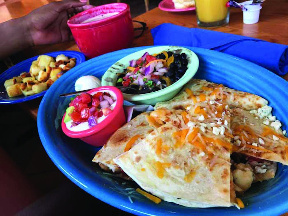 The buffalo chicken quesadilla is served with a side of black beans. Photo by Peter Garcia.

