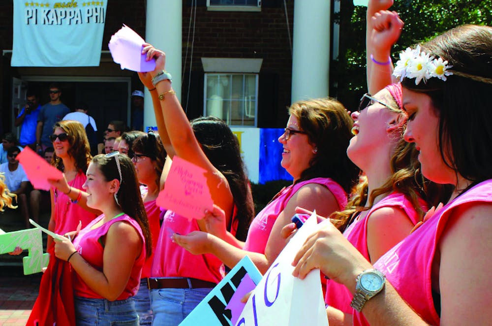 Chapter members of Alpha Gamma Delta lined up on bid day to welcome their new members