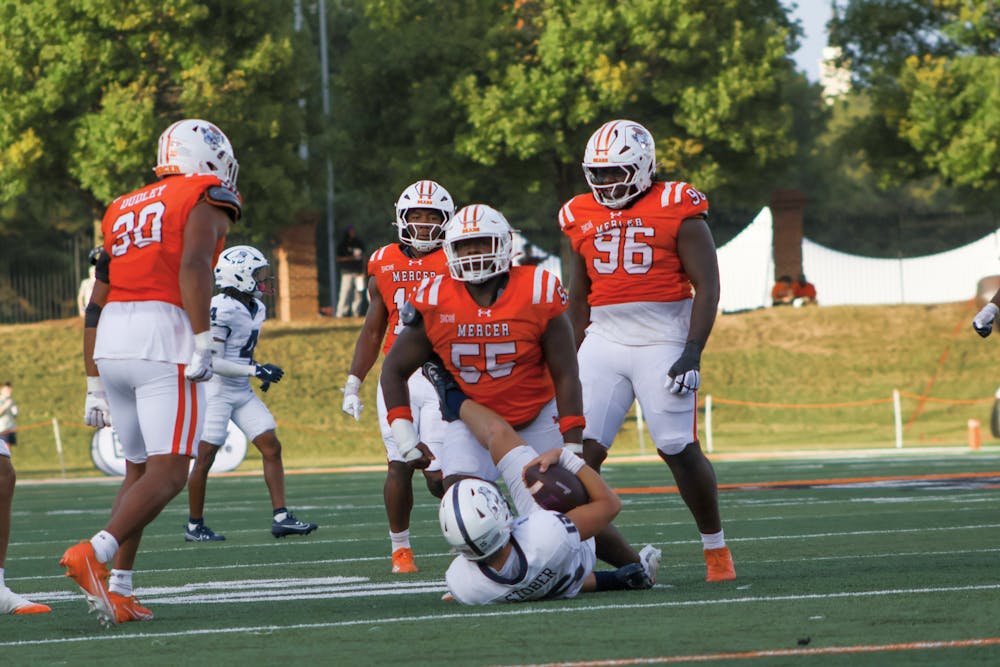 Defensive lineman Ean Johnson-Kelley '29 celebrates a sack against Samford University on Oct. 4.