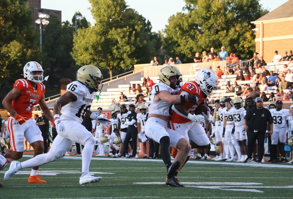 Running back Micah Bell '27 is tackled by a defender in Mercer's 22-21 victory over Wofford College on Sept. 13. 