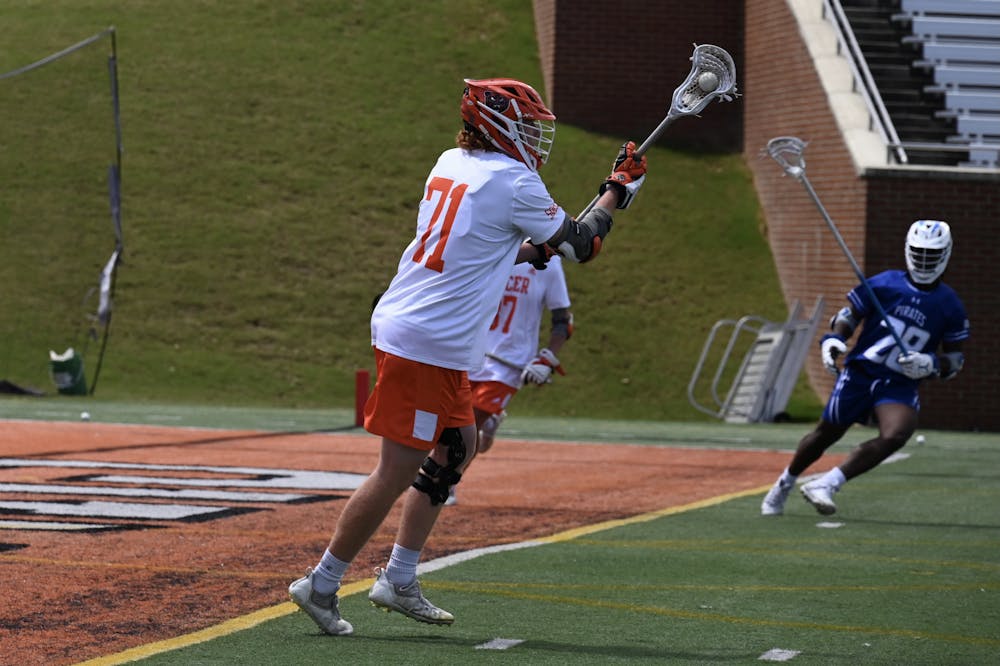 Ryan Brooks (71) receives a pass from Brandon Paxton (37) in the game against Hampton on Saturday, Apr. 9. The Bears defeated the Pirates 22-6 and have a 4-8 overall record and 1-1 conference record.