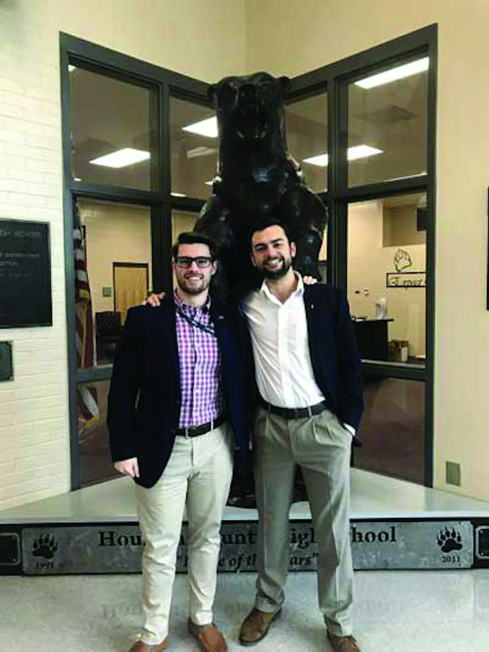 Brandon Hancock and Jonathan Kenton, founders of Newt Technologies, posing in front of bear statue at Houston County High School. Photo provided by Hancock and Kenton.
