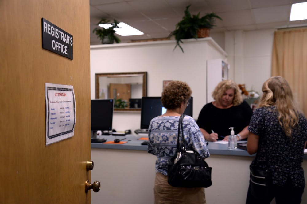 Audrey Drummond, a transfer student, right, and her mother, Amy Drummond, left, talk to April Cantrell, a registrar specialist at Mercer University, in the Office of the Registrar on August 11. To change your major, you must turn in your major declaration form to the Office of the Registrar.
