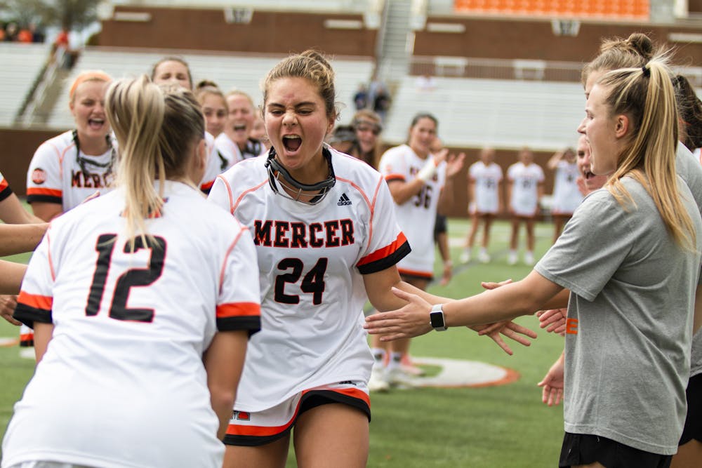 Mercer's Ainsley Malamala (#24) and her team celebrate during the Bears 20-5 victory over Wofford in March of 2021.