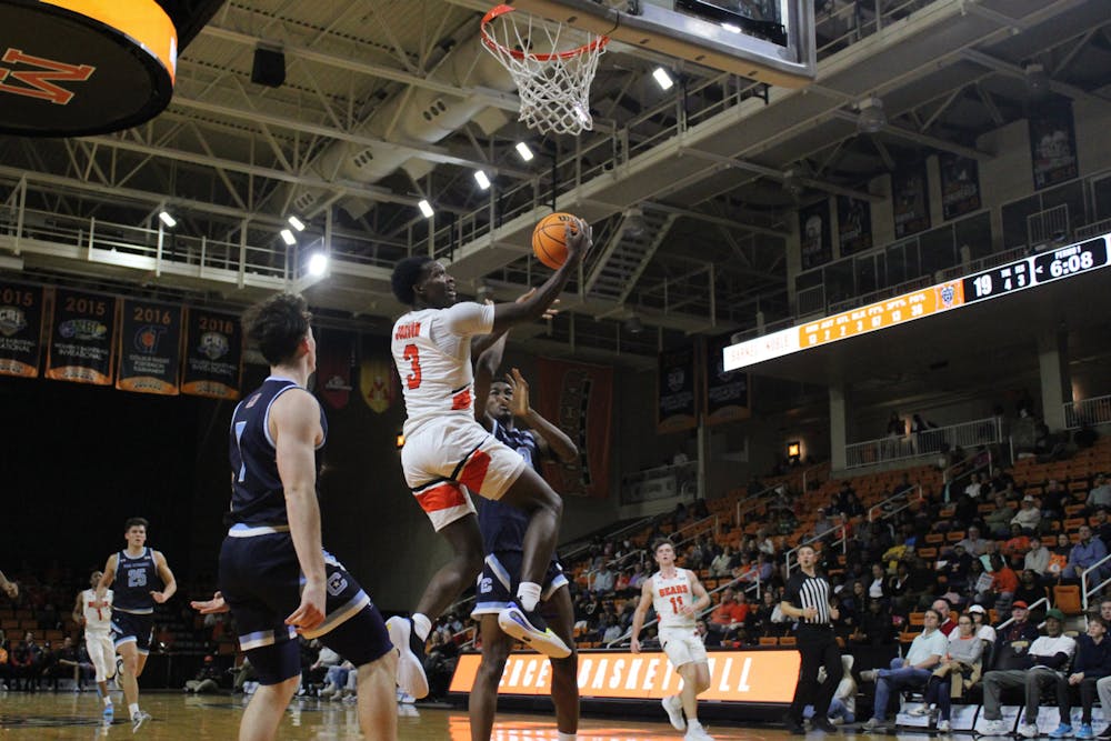 Tyler Johnson '25 goes up for a reverse layup against The Citadel on Wednesday night. Johnson led the team with 18 points and added four steals.