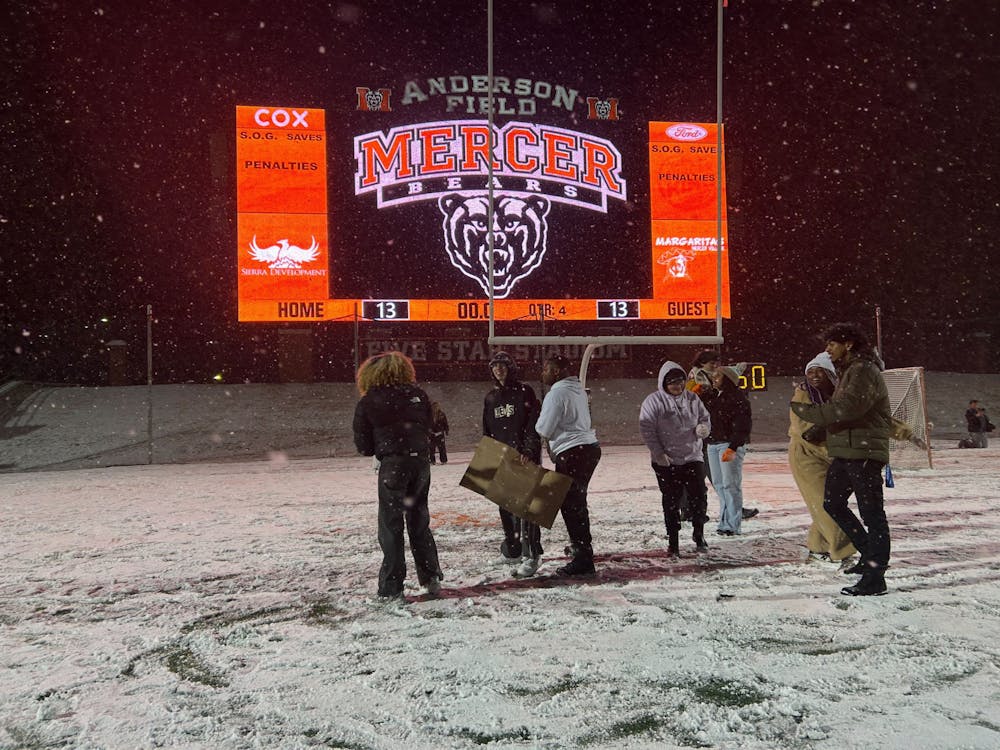 Mercer students play in the snow on the field of 5-Star Stadium on Jan. 21, 2025.