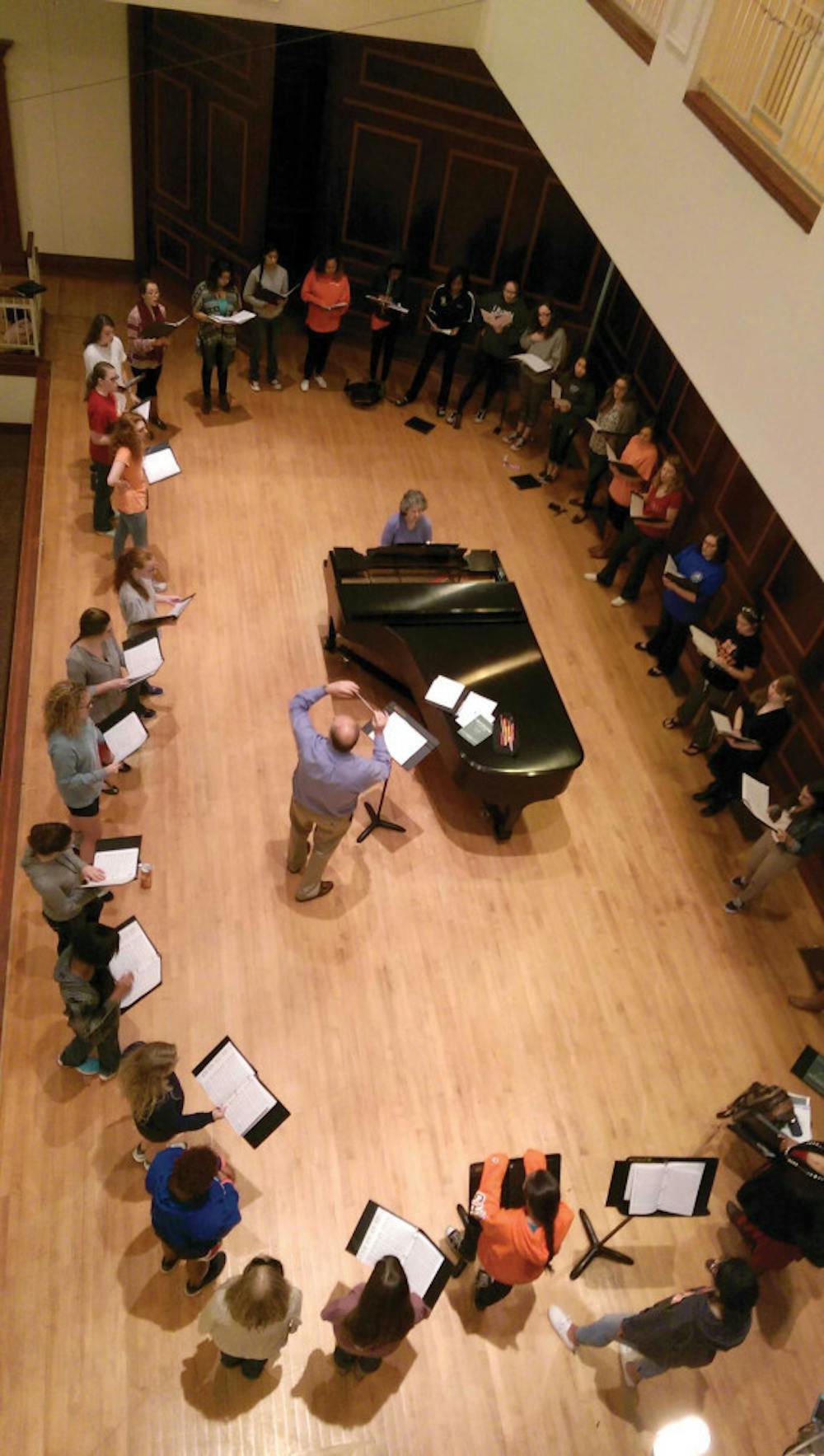 Mercer Women's Chamber Choir rehearse for the upcoming Thanksgiving Song concert, under the direction of Dr. Stanley Roberts. 