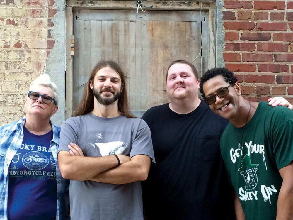 Royal Johnson members Andy Johnson (guitar and vocals), Chance Royal (guitar), Kevin Vines (bass and vocals), and Joanie Ferguson (drums and vocals) take photo for Belly Full album release.