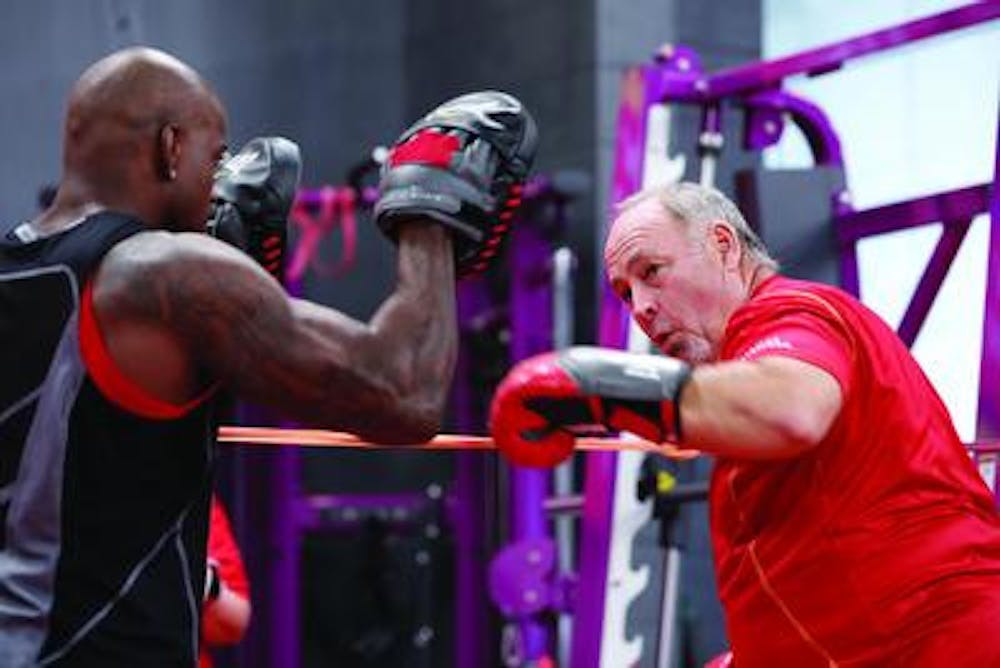 Warner Robins native Robert Kidney punches it out with help from trainer Dolvett Quince.