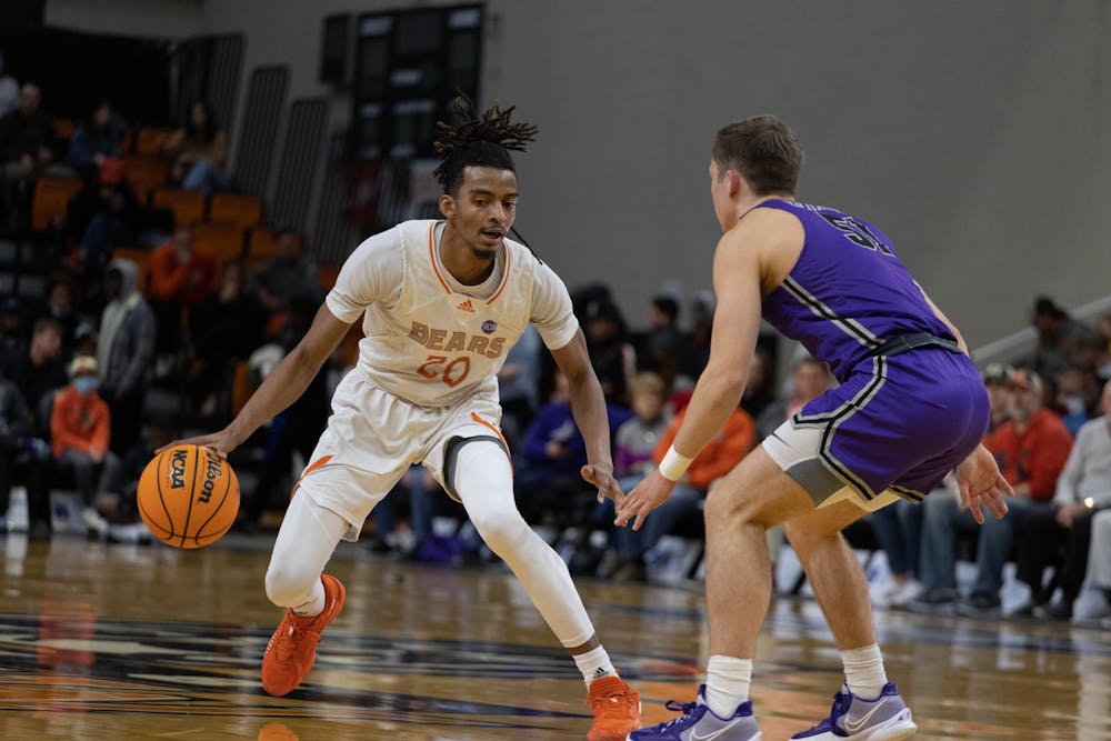 Mercer guard Jalen Johnson (#20) looking to make a move past a Furman defender. The Bears went on to lose this game 50-80.