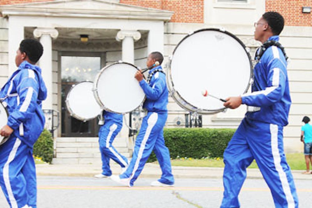 A local high school marching band makes their way down to Cherry Street during last year's Cherry Blossom parade.