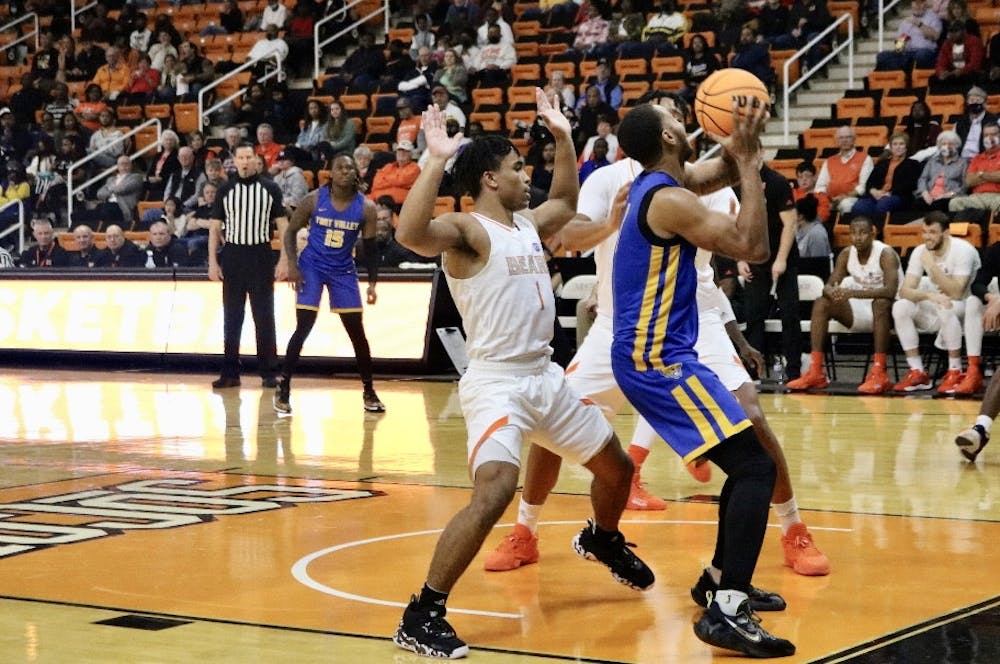 <p>Kamar Robertson (#1) guards Fort Valley State player in the first period of the season opener.</p>
