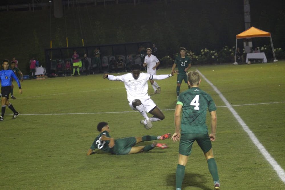 <p>Mercer midfileder Ousman Jabang leaps over a defender from Jacksonville University in their game on Oct 19. Mercer went on to win the game 1-0. </p>