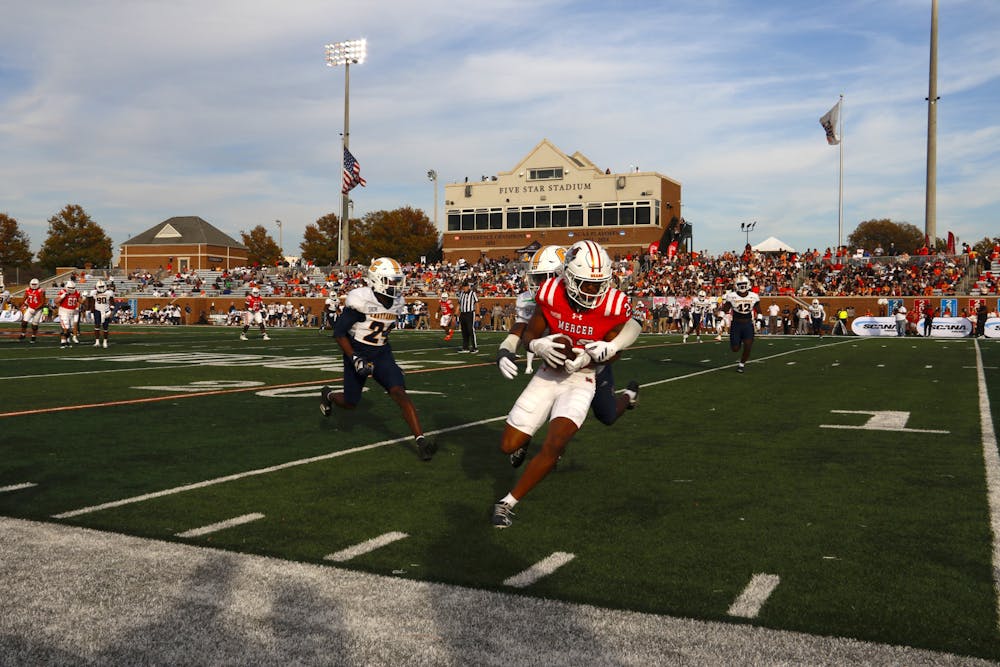 Travion Solomon '27 is tackled after an 18-yard reception in a 63-17 win against the University of Tennessee at Chattanooga on Saturday, Nov. 15, 2025.