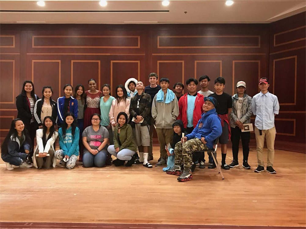 Sophie Leveille stands with a group of refugees from Jubilee who performed in “Stateless: Unity, Hope, and Dreams of the Future,” the benefit concert at Mercer's Fickling Music Hall last Wednesday that benefitted Jubilee and Leveille's music-education program.