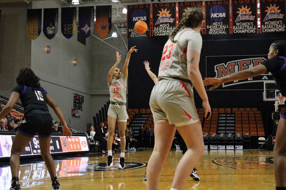 Kayla Smith '26 shoots over an outstretched Furman University defender on Saturday, Jan. 25. Smith started her second game of the season against the Paladins, dropping two points, two rebounds and an assist in the Bears' loss.