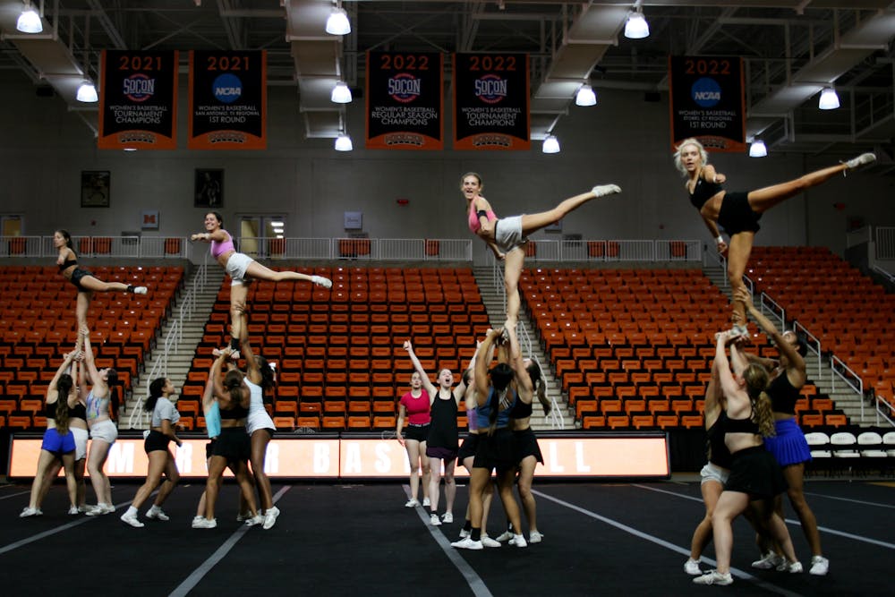 <p>The Mercer cheer team rehearsed a routine in Hawkins Arena, where they are pressed to find adequate practice time since they share the space with other athletic programs.</p>