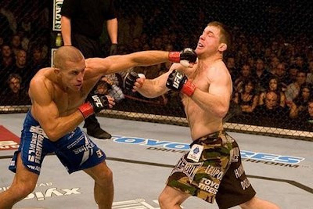 (photo courtesy of punchkickchoke.blogspot.com) George St. Pierre (left) top Gene's list as the top MMA fighter with his superb fighting record.