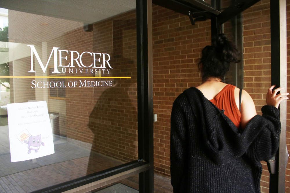 A student enters the School of Medicine at Mercer University. Photo by Emily Rose Thorne.
