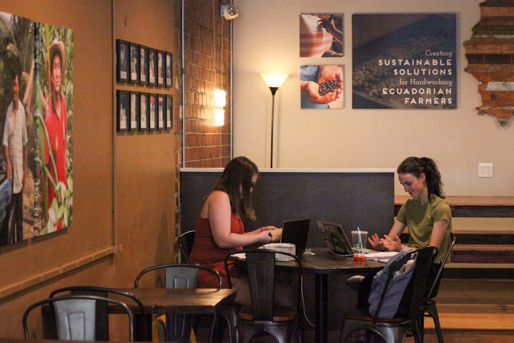 <p>Mallory Green (left) and Seiler Rivers (right) study at Z Beans in Mercer Village. Photo by Samantha Vaquero.</p>