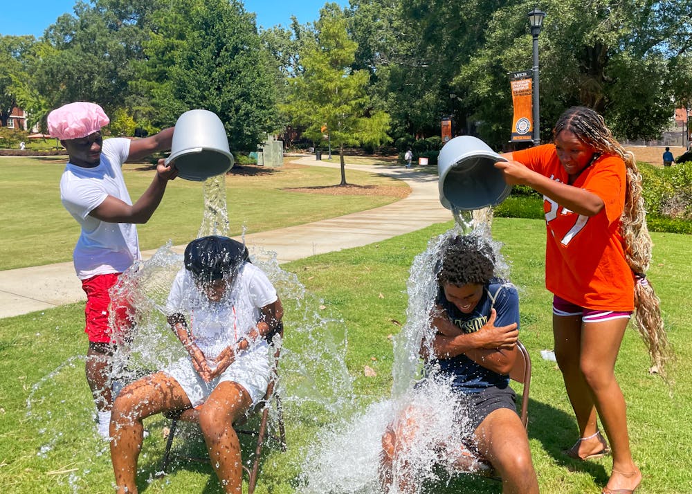 <p>In a plot twist, MU Runway executives ditch the runway and instead drench each other with water. Pictured members include Kester Kwazema ‘28, Jassmyn Nesmith ‘26, Charlie Minton ‘27 and Taylor Goodly &#x27;25.</p>