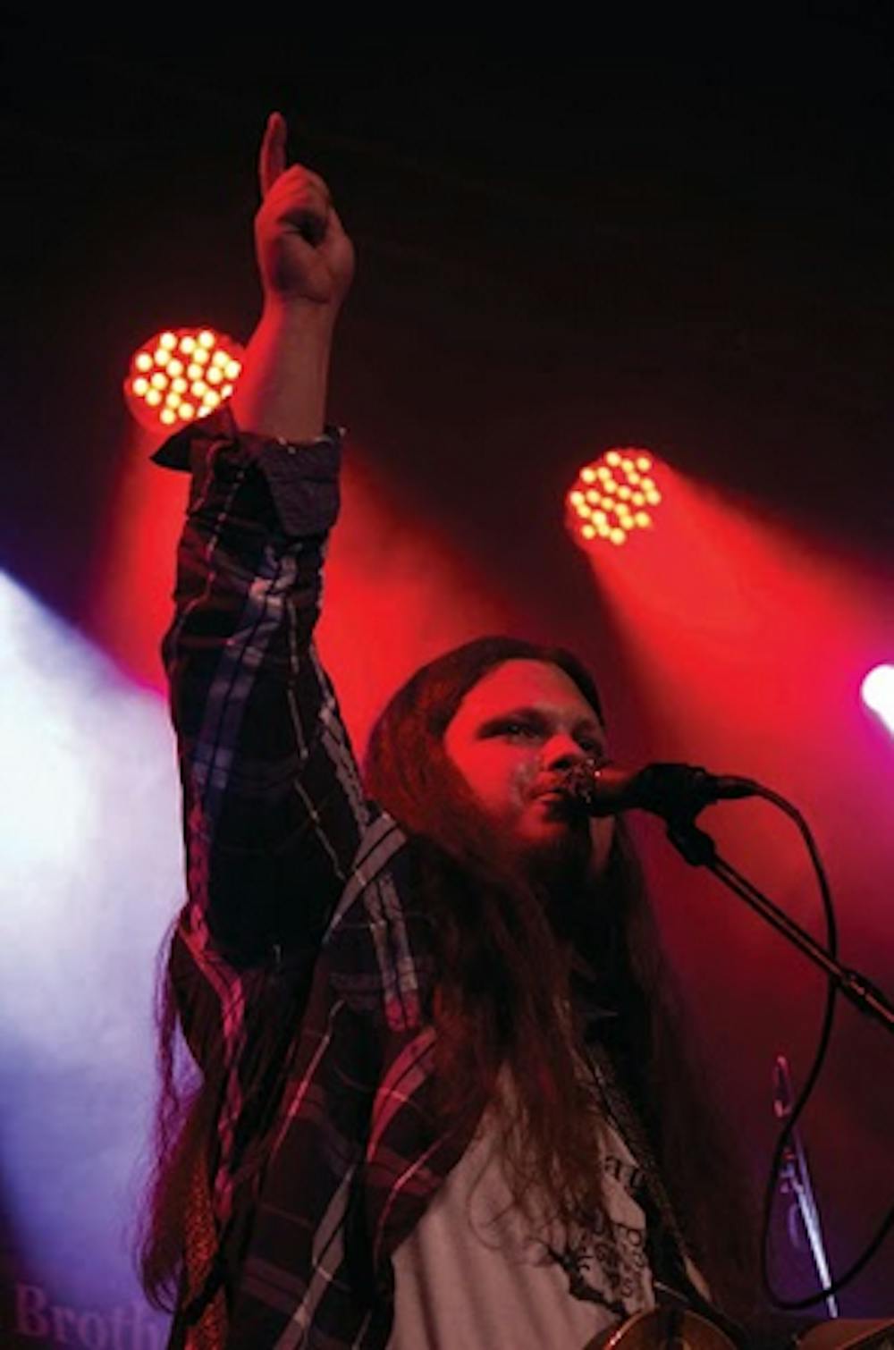 Steve Jewell, Jr. show opener OTIS calls out to the crowd between songs. The event was moved from the Big House Museum to the Cox Capitol Theatre over weather concerns.