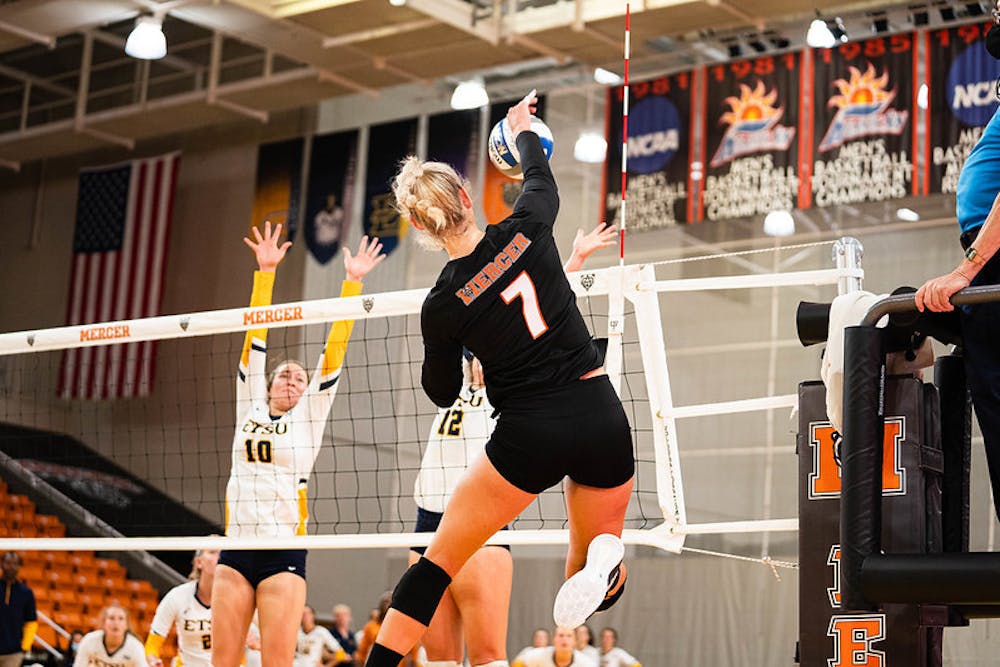 <p>Outside hitter Taylor Lynch (#7) going up for a spike in the Bears game against ETSU on Nov. 6. Credit: James Thomas </p>