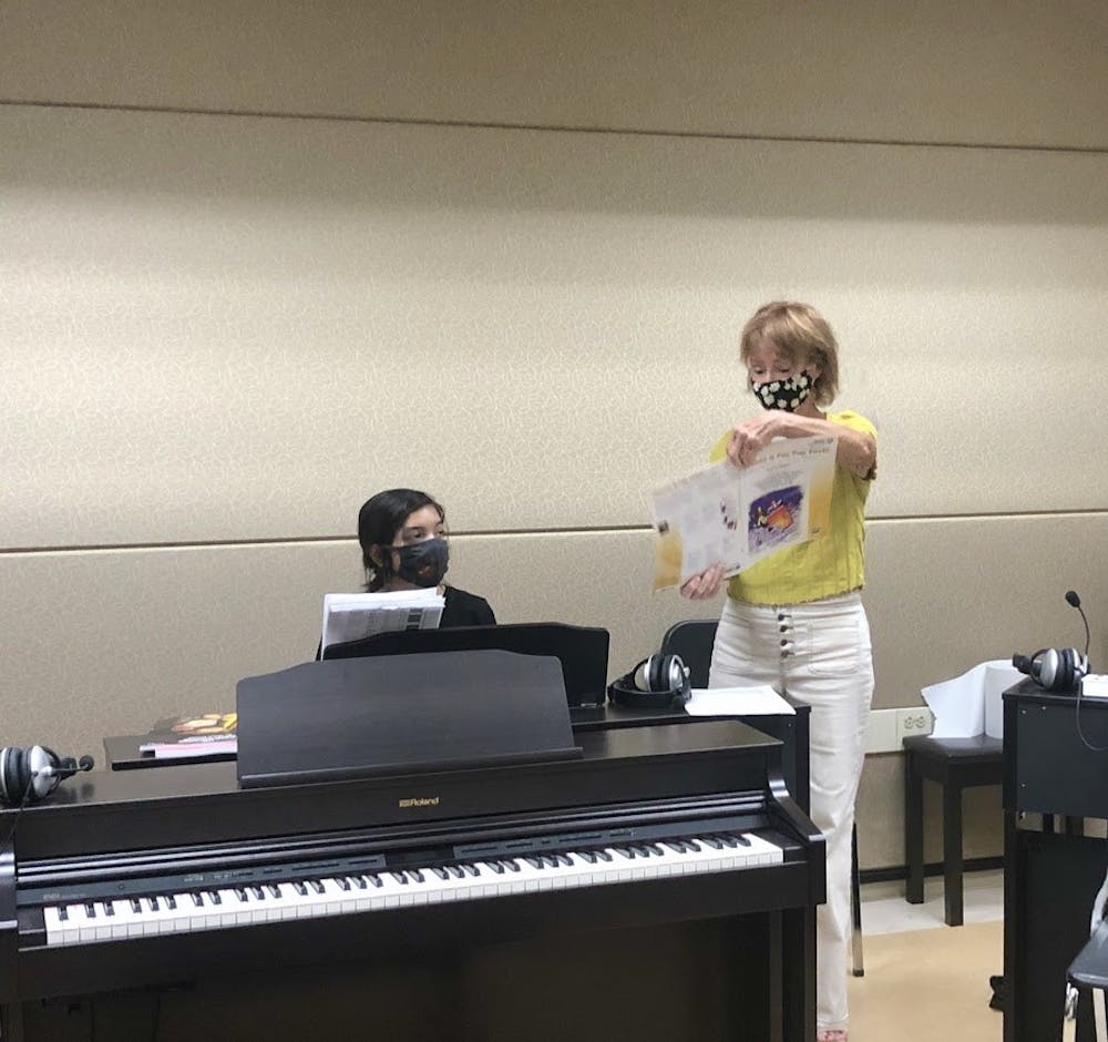 Music student Melody Little receives instruction from Piano 1 professor Gail Pollock during the COVID-19 outbreak. Pollock also said that she disinfects the area with Pledge Antibacterial Surface Cleaner between classes.