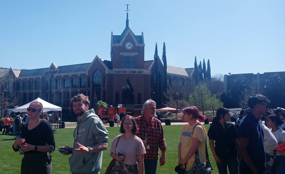 <p>Bearfest attendees wait in line on Cruz Plaza on Friday, March 13.</p>