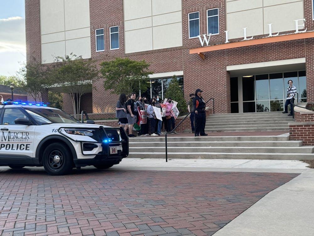 The initial April 4 protest at Jennifer Grossman’s guest lecture with the Center for the Study of Economics and Liberty and Turning Point USA (TPUSA). Despite social media outcry from TPUSA, the intial protest did not actually restrict access to the event.