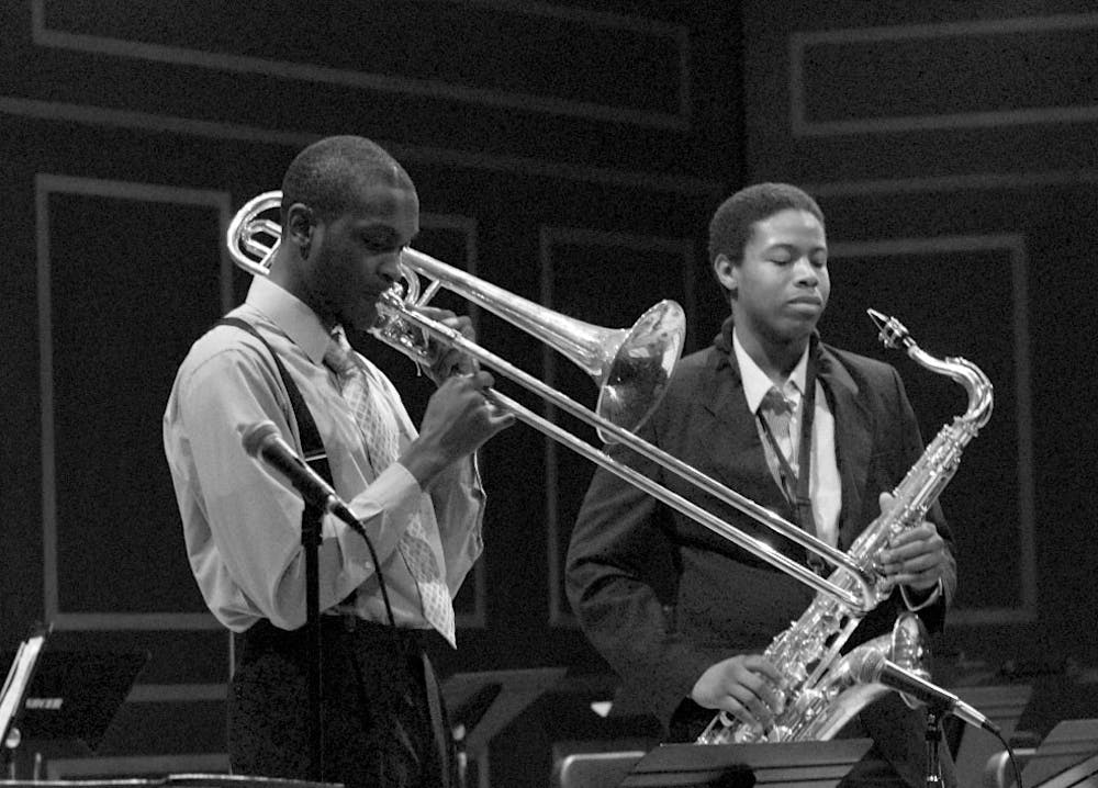 Roy Miller, left, and Justin Robinson, right, jazz out at the Latin Jazz Ensemble. 