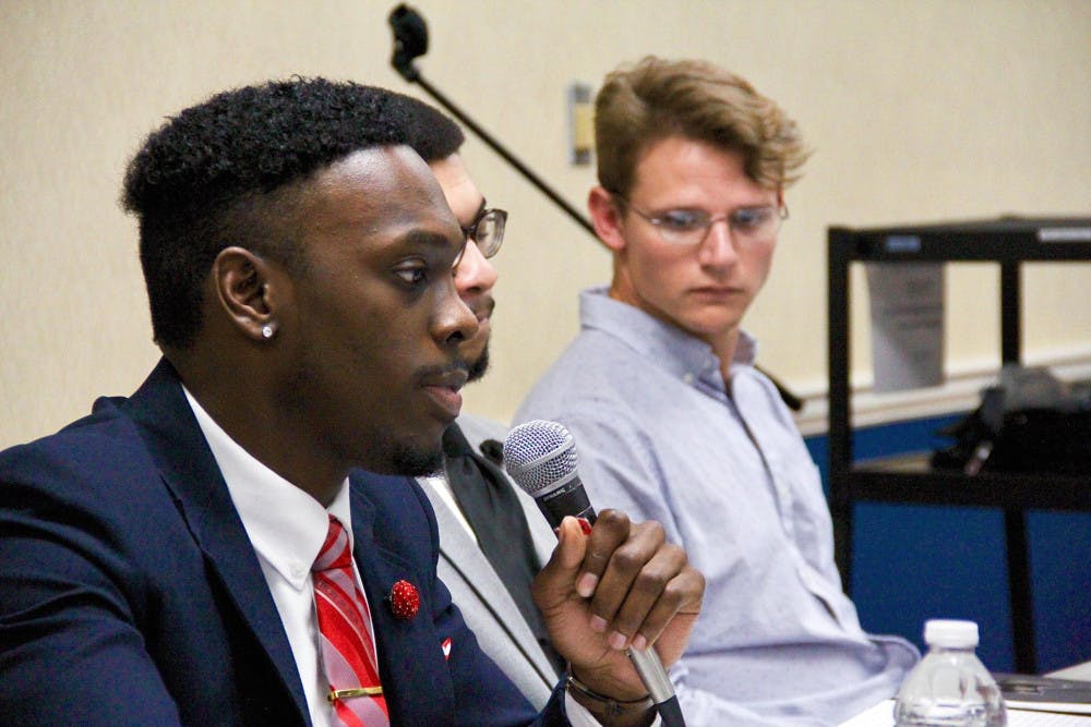 Nnamdi Onyekwuluje, president of the Organization of Black Students, speaks on the peace panel. 