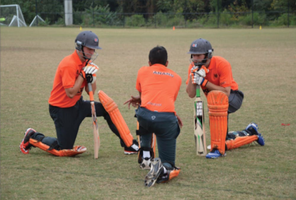 Sameer Anand, center, speaks with Sam Brunke, left, and Wesley Evermon, right, before the team's match against Georgia Southern on Oct. 25, 2015.