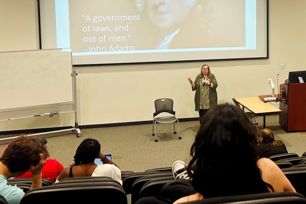 Lori Johnson giving a lecture about the rule of law at the Friday teach-in on March 27.